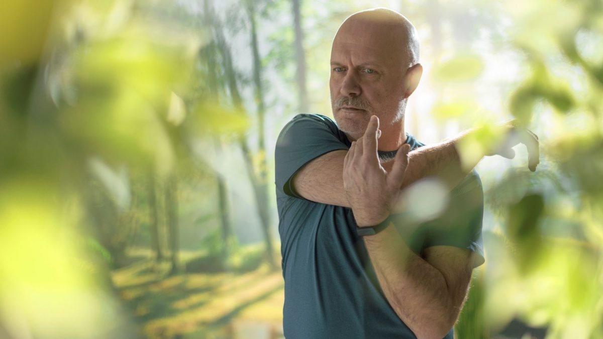 Middle aged man stretching